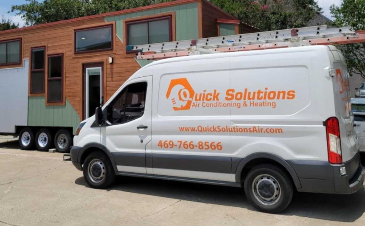 Service van parked outdoors near a building